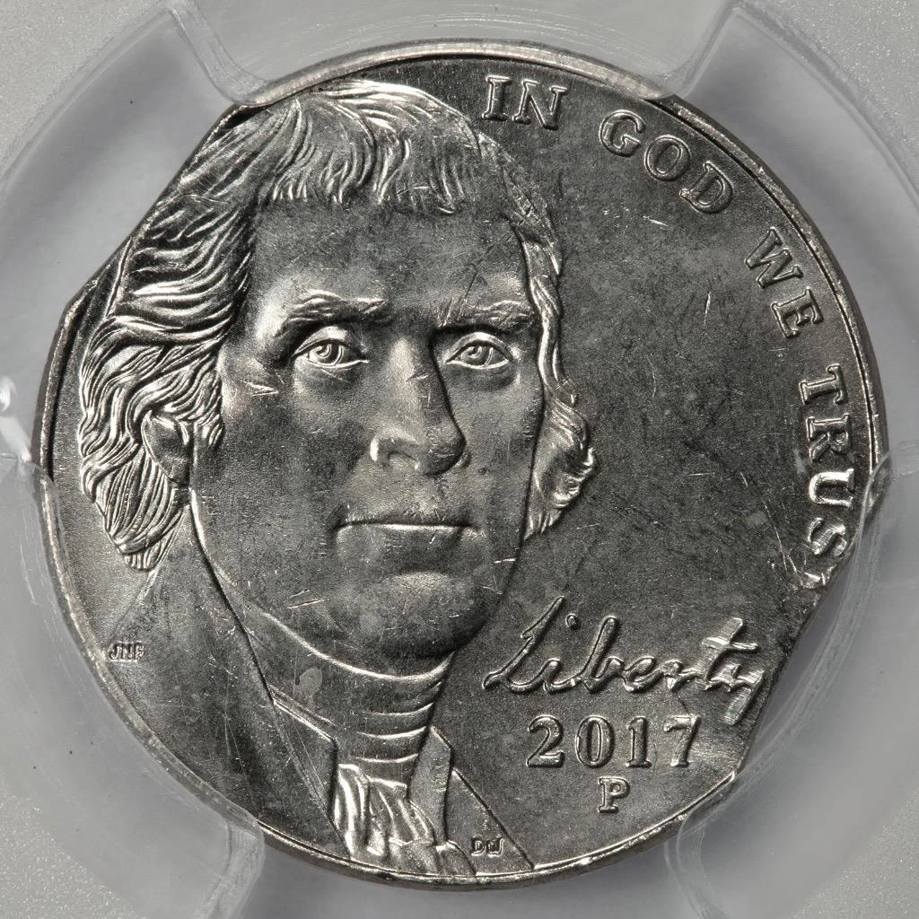 2017 nickel clipped planchet error with curved section missing from coin edge showing Blakesley effect